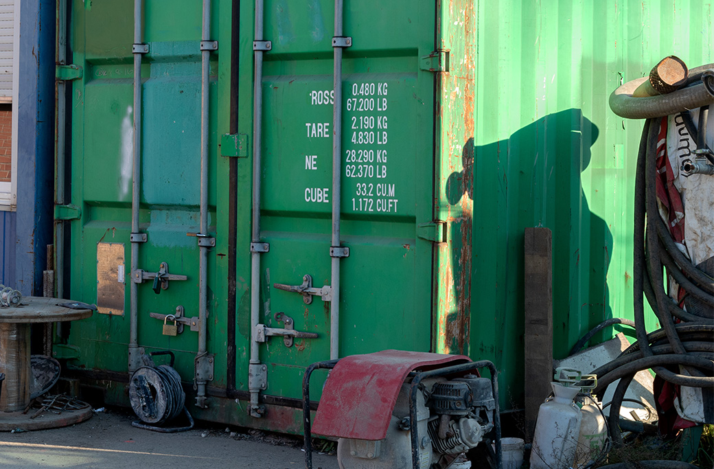 Multiple construction materials ready to be organized inside a shipping container.