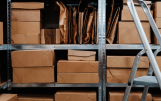 Retail employee organizing seasonal inventory inside an onsite storage container.