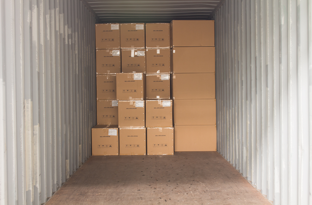 boxes packaged neatly in back of mobile storage container